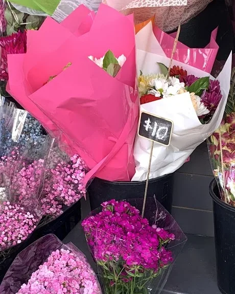 A small mixed bunch in hot pink paper