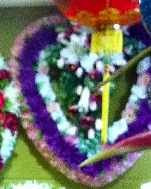 A heart wreath of purple and white flowers